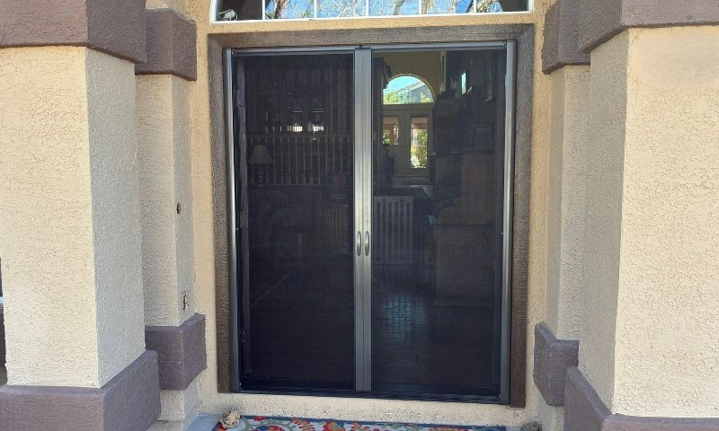 Apollo double retractable screen doors installed on French entry doors